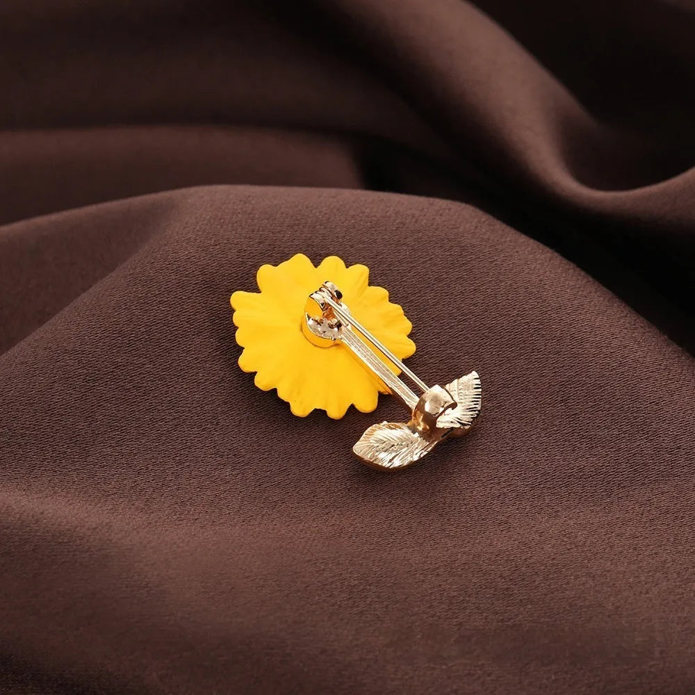 Close-up of a sunflower brooch pin for women, alloy electroplated finish, 2.4 cm by 3.1 cm size