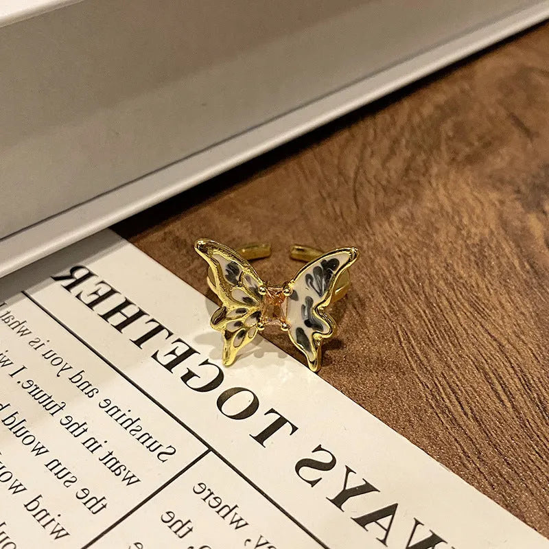 Simple copper women's ring with a Chinese butterfly design, showing an example from the 33 available numbered styles.