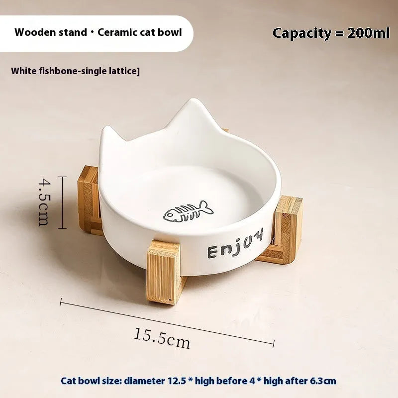 Porcelain cat bowl with cat ear and paw design on a wooden feeding frame, in pink colour.
