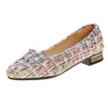 Women's black canvas casual flats with pointed toe and low-cut design on flat rubber sole