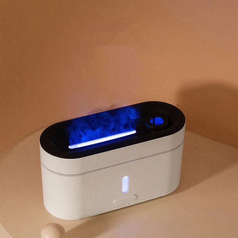 White resin flame lamp humidifier with two fog outlets and visible flame effect on a wooden table