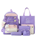 Set of four nylon student backpacks in pink, black, purple, and blue colours with curved shoulder straps