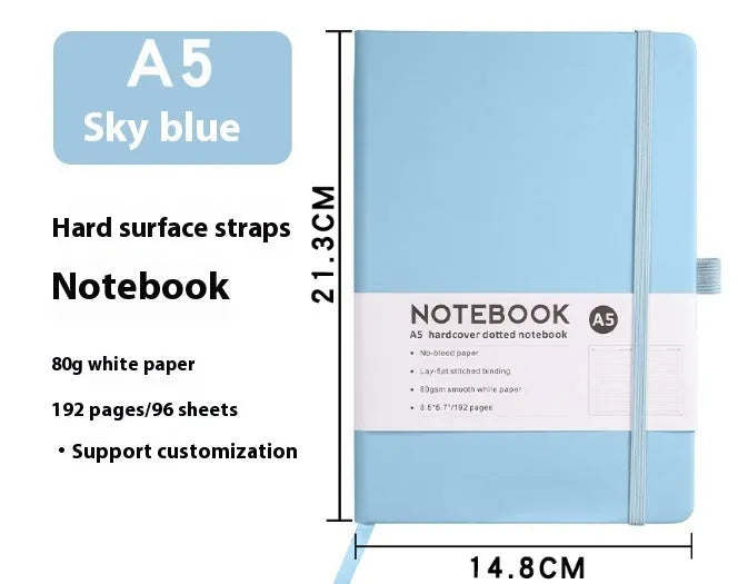 A5 and A6 size notebooks with soft skin-feel PU leather covers and a strap, shown in various colours next to open pages with horizontal ruled lines.