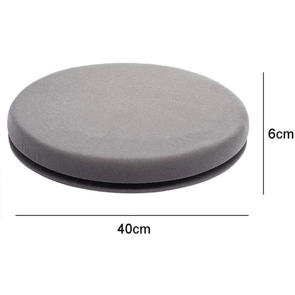 A grey 360-degree rotating car seat cushion on a car seat, showing its non-slip base and plush fabric cover.