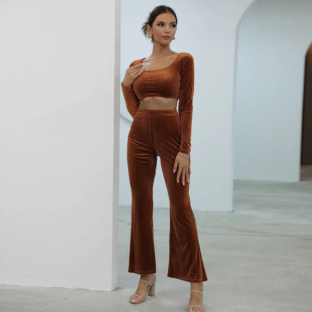 Caramel coloured long sleeve sweater and trousers co-ord set on a hanger
