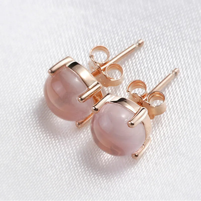 Women's rose gold drop shape stud earrings with synthetic ross quartz crystal inlay