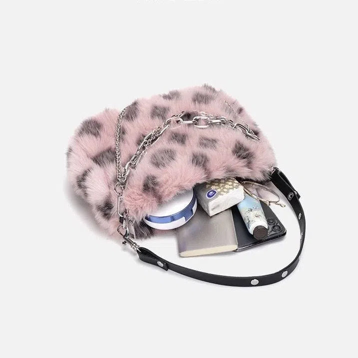 Plush luxury-style chain bag in apricot with leopard print and gold-tone chain, horizontal rectangular shape, soft texture.