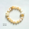 Hand-woven bracelet with 10mm round gray agate and mellite beads, Ivory Xingshi style, unisex design.