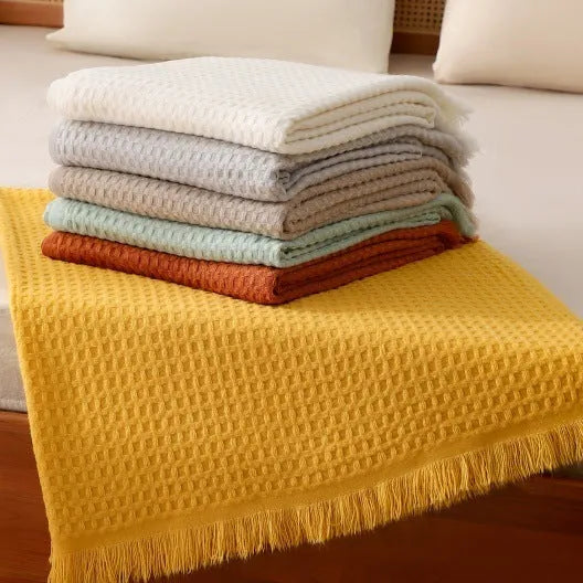 Solid colour waffle knit sofa blanket in acrylic with chenille texture, beige finish, 130x160cm with tassels
