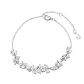 White copper wisteria flower bracelet with electroplated white gold finish featuring bow leaf and drop shapes