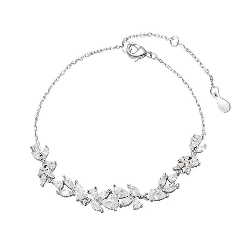 White copper wisteria flower bracelet with electroplated white gold finish featuring bow leaf and drop shapes