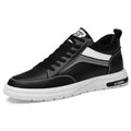 Men's black and white low-top lace-up casual sneakers with hidden height increase insoles on a rubber sole.