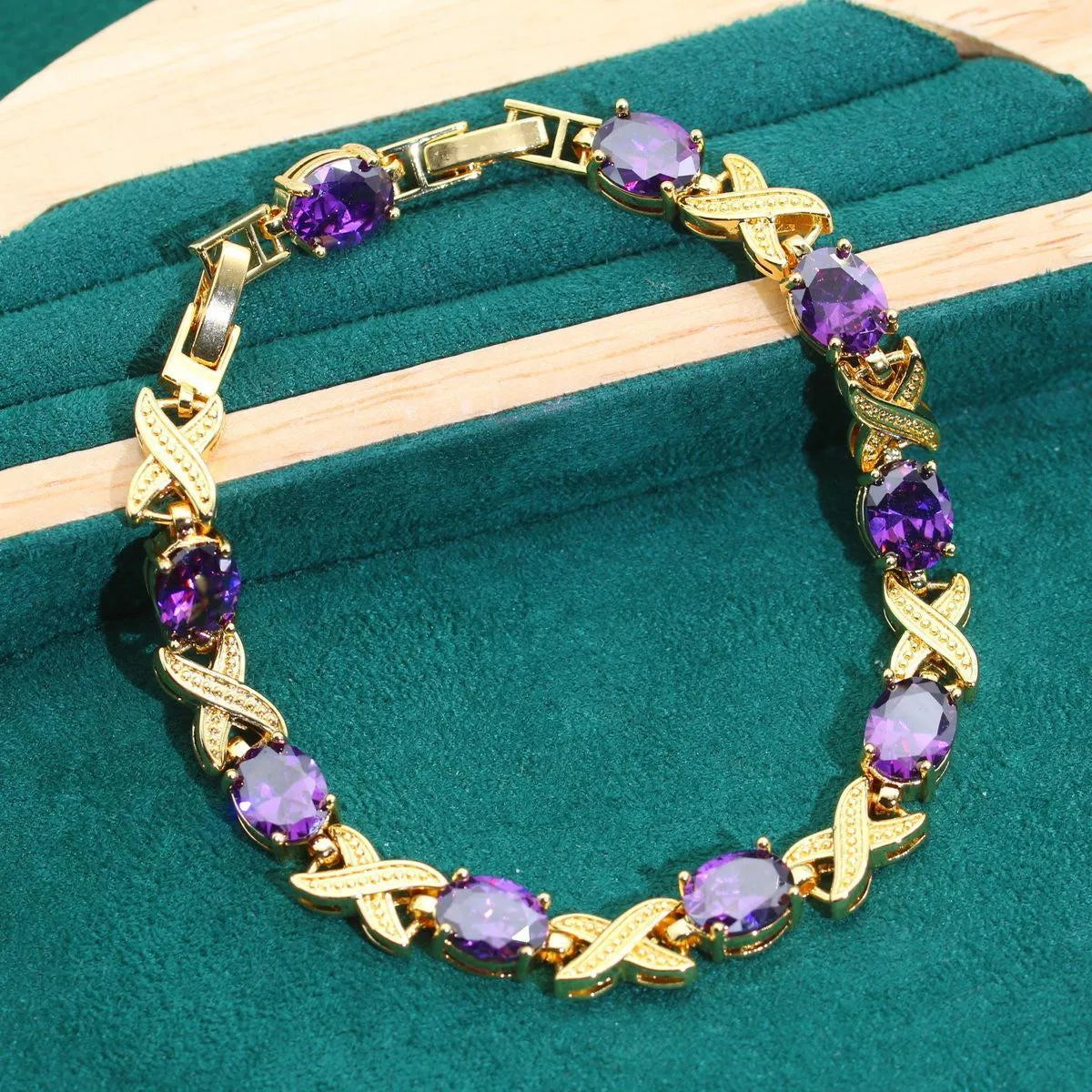 Gold-plated jewellery set with multi-colour zircon stones including necklace, earrings, ring, and bracelet.