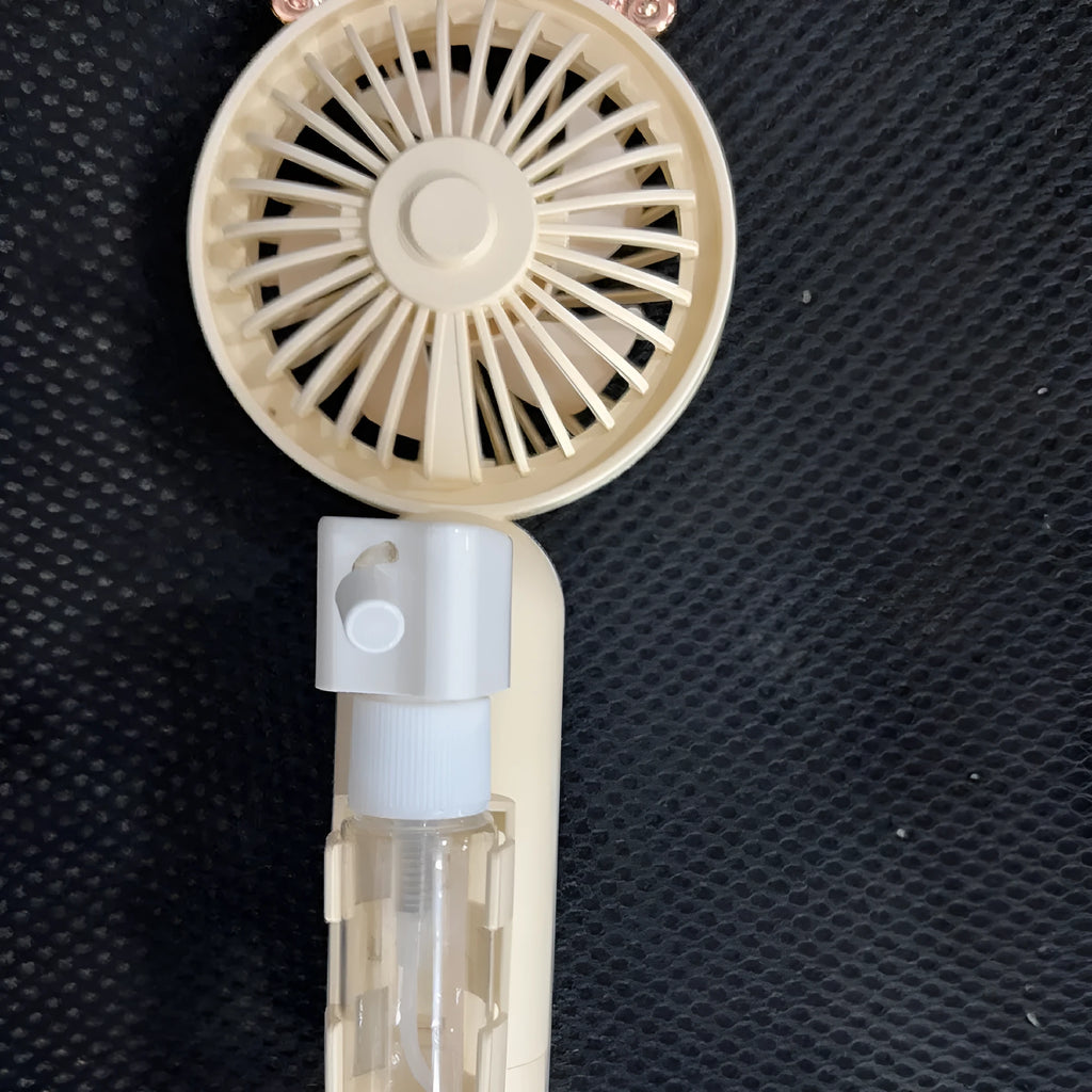 Compact plastic USB personal fan in a choice of five colours: apricot, blue, green, orange, or pink.