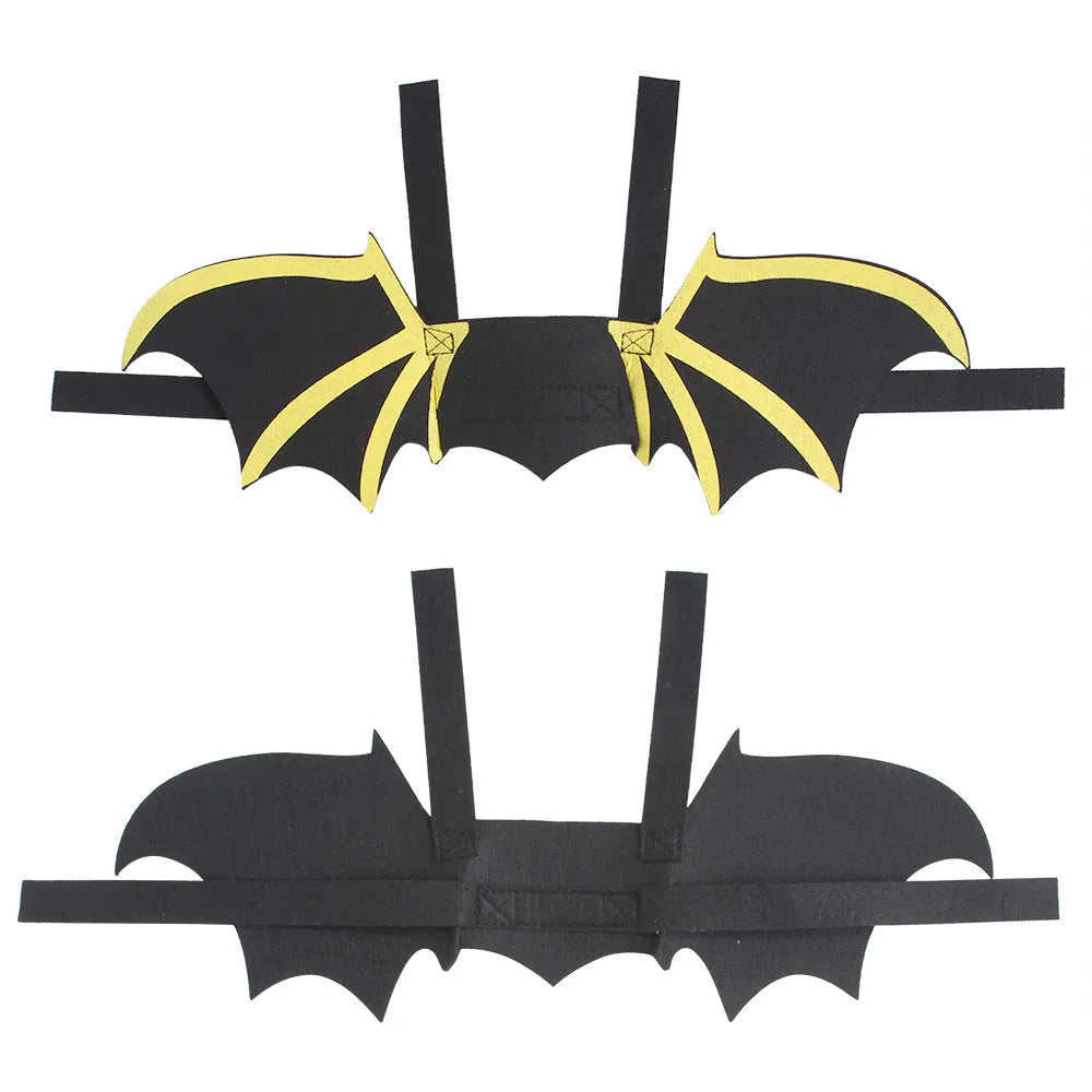 Pet dog or cat wearing a cloth bat-wing print costume with bell on a plain background