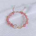 Handmade strawberry quartz crystal bracelet with Hetian jade peach blossom accents in natural style