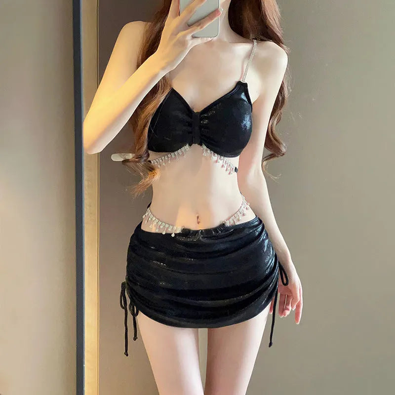 Women's solid colour bikini swimsuit set in black or pink, made from polyester fabric.