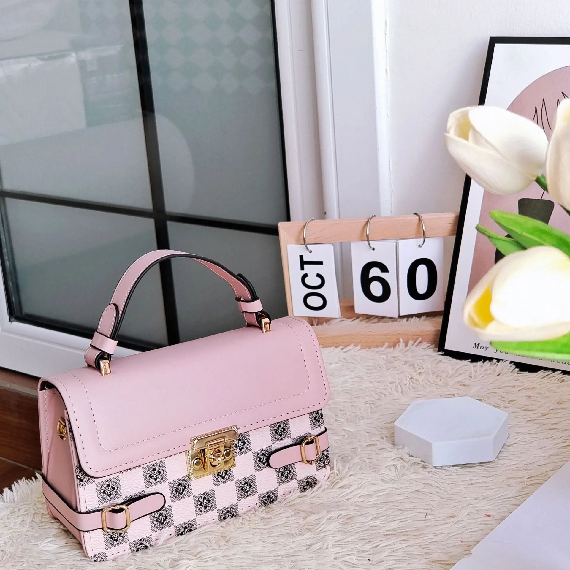 Retro small square pattern crossbody bag in apricot colour, showing horizontal square shape and stitching detail.