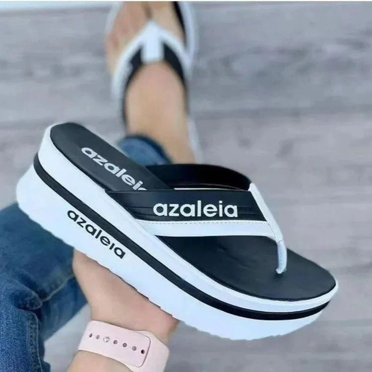 Women's solid colour PU platform summer slippers with a herringbone toe holder design.
