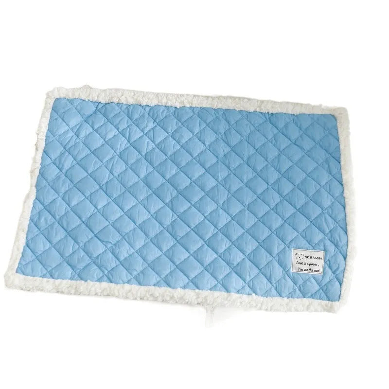 Soft blue terry cloth pet blanket for cats, shown on a pet bed, with size and colour options displayed.
