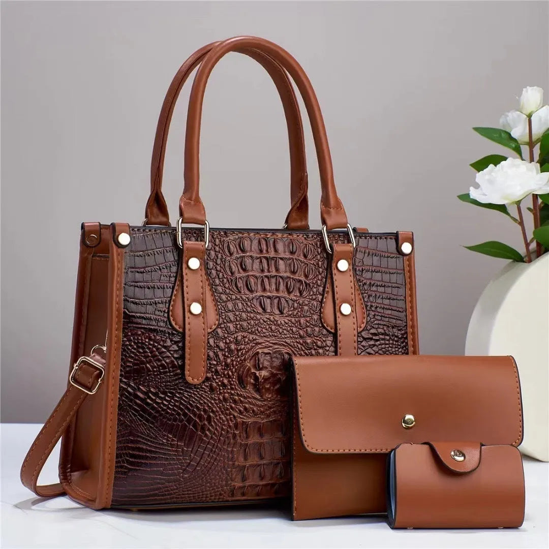 Contrast colour minimalist textured three-piece set showing crossbody bag, wallet, and card holder in burgundy.