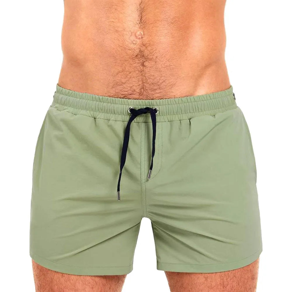 Men's solid colour polyester sports shorts with mesh lining in six colour options
