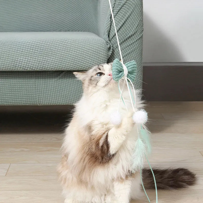 Blue cat teaser toy with feather attachments on long bite-resistant pole for interactive play