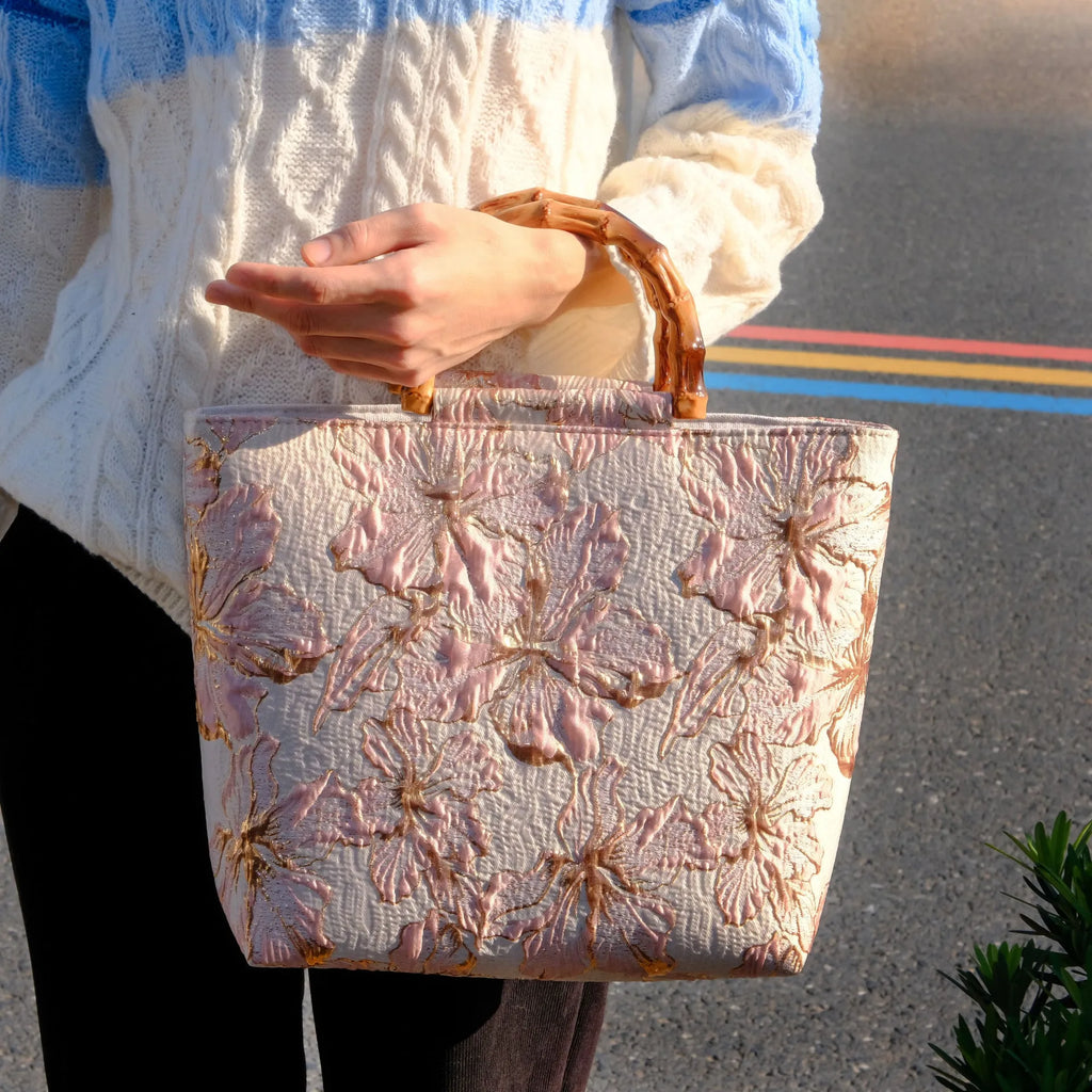 Light blue women's canvas bag with bronzing flower detail and double shoulder straps