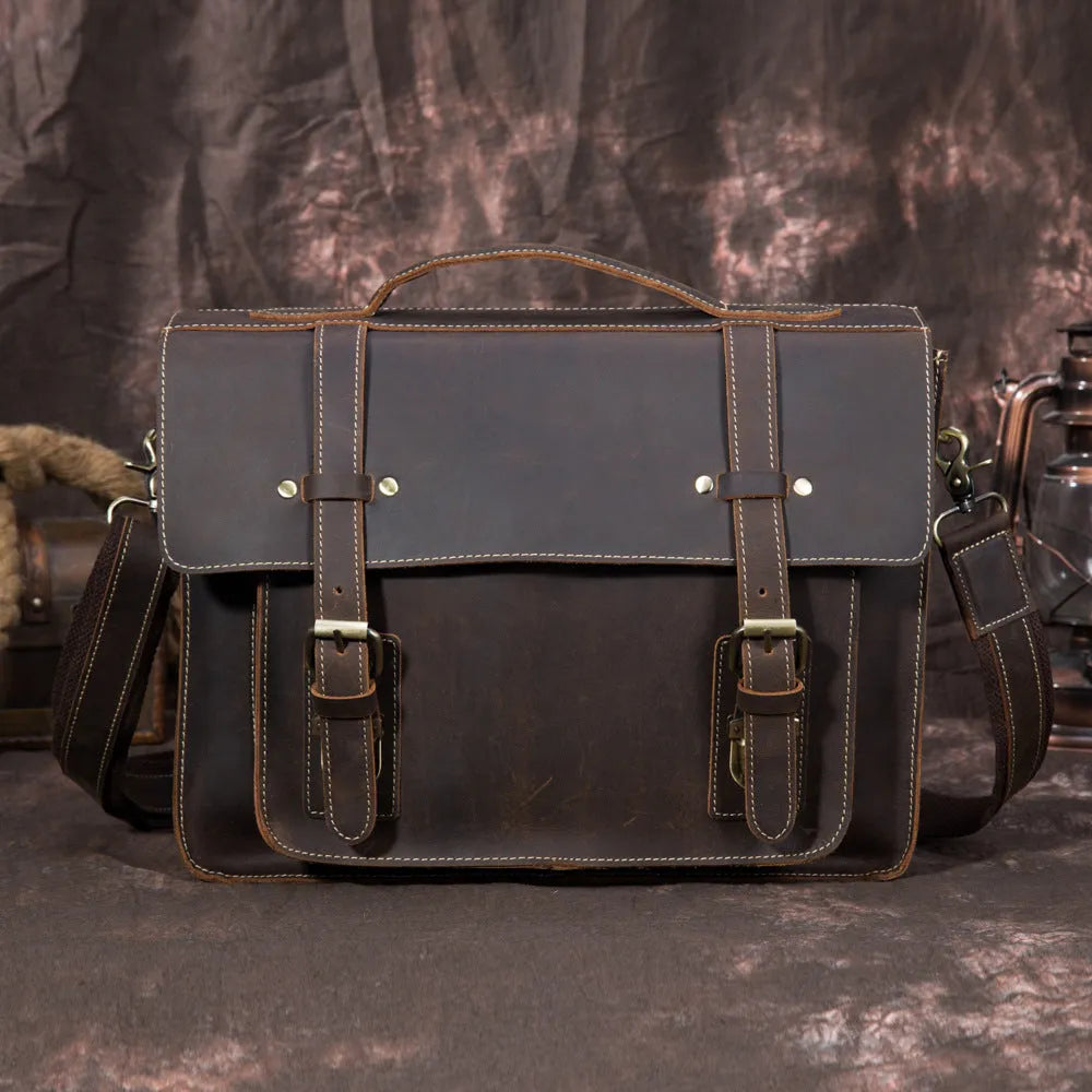 Men's handbag in dark brown coffee first layer crazy horseskin leather, shown as a shoulder bag on a model.