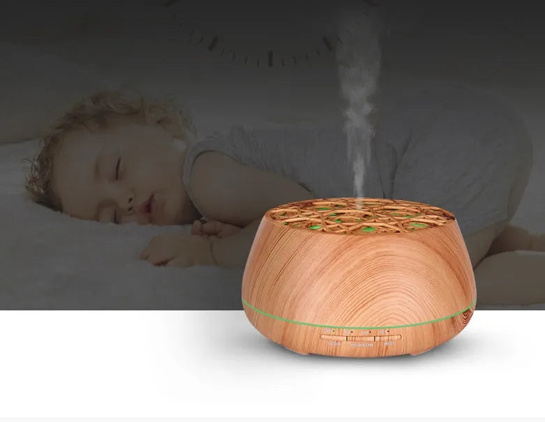 Four-hole misting ultrasonic aroma diffuser in dark wood grain finish with 400ml capacity and control buttons