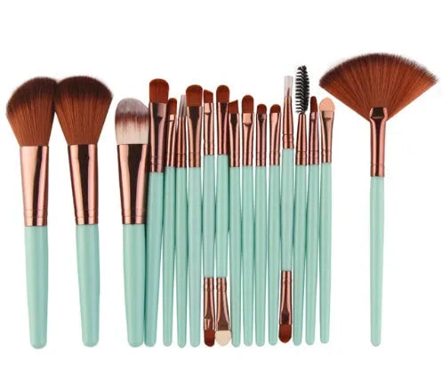 18-piece make-up brush set with fan-shaped brushes laid out on a table.