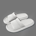 Solid striped EVA non-slip home slippers in grey, one-word style, for women and men