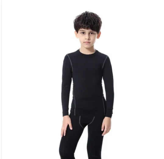 Children's black and green sportswear set showing T-shirt, trousers, and shorts on a size chart.