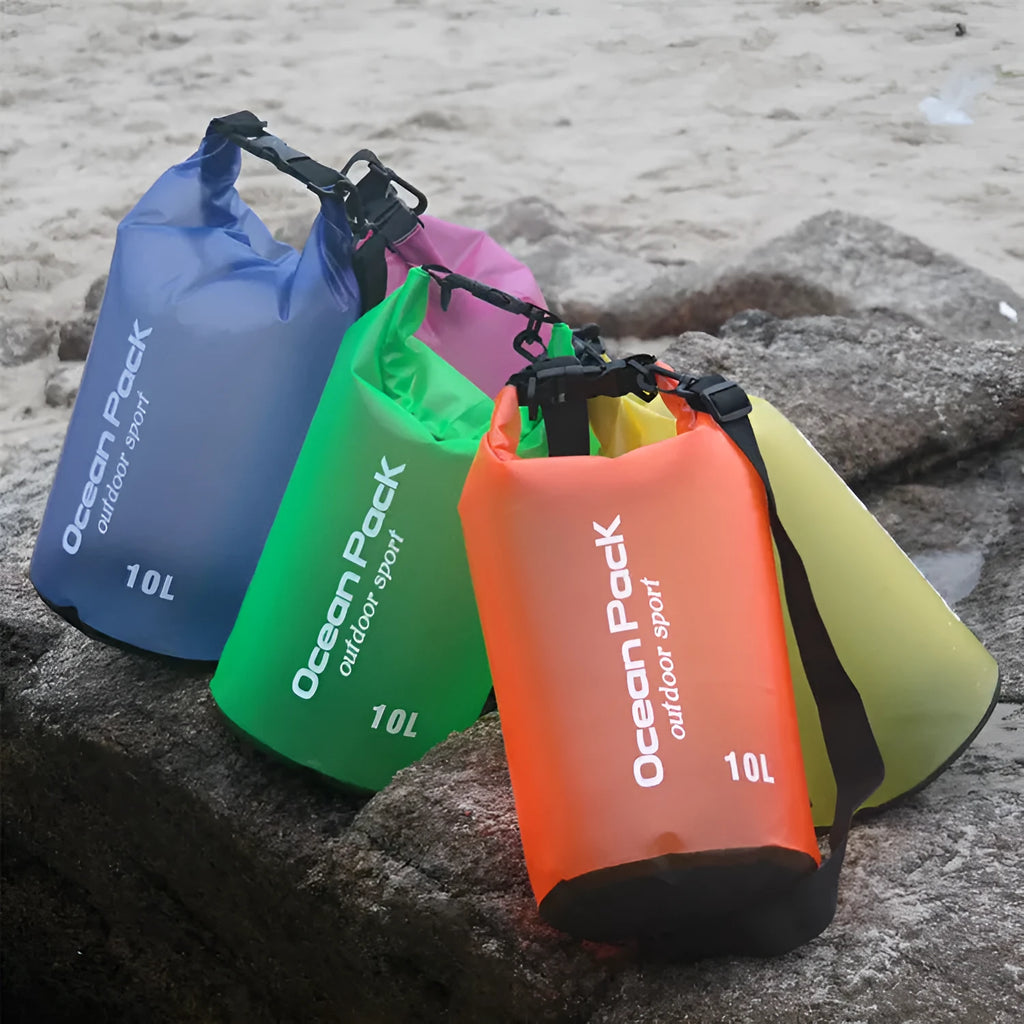 Waterproof PVC bucket bag in blue on beach, 15L size showing drawstring closure and bucket shape
