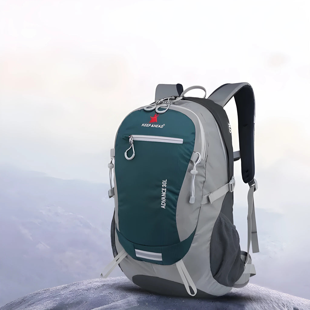 30 litre dark green nylon hiking backpack with airpillow straps shown from a side angle.