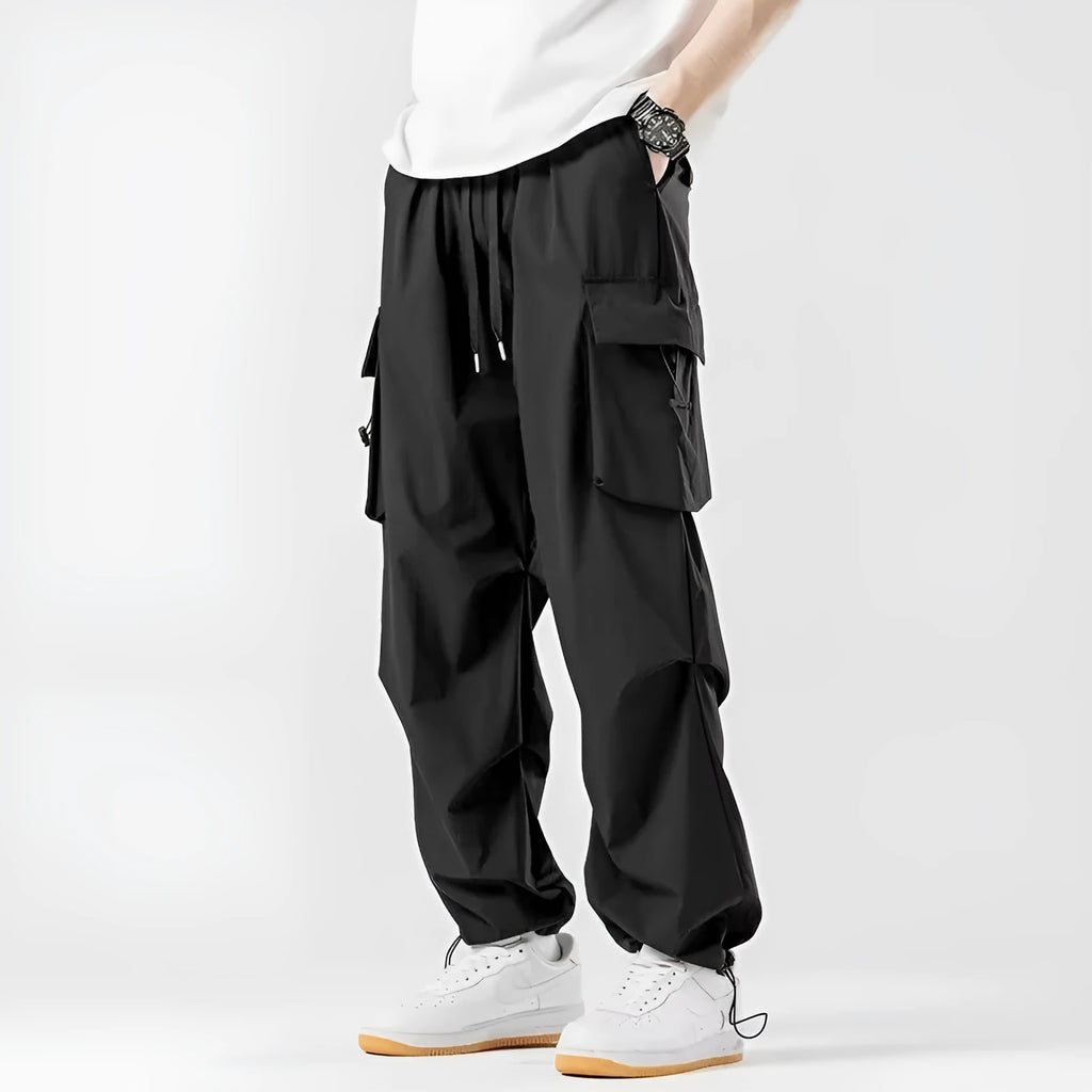 Men's loose straight cargo pants in black with wide-leg cut and drawstring waist