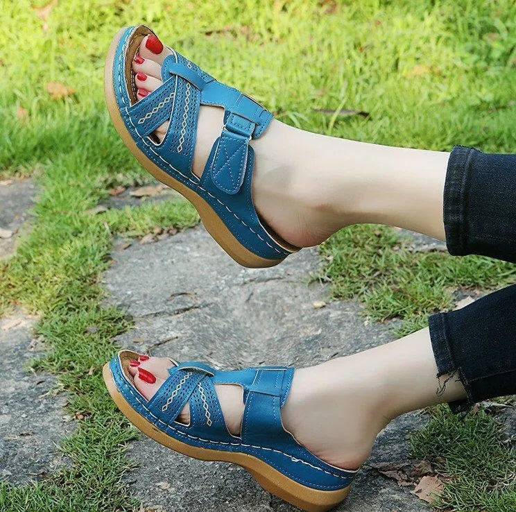 Women's black hollow peep toe wedge sandals with a Velcro strap closure