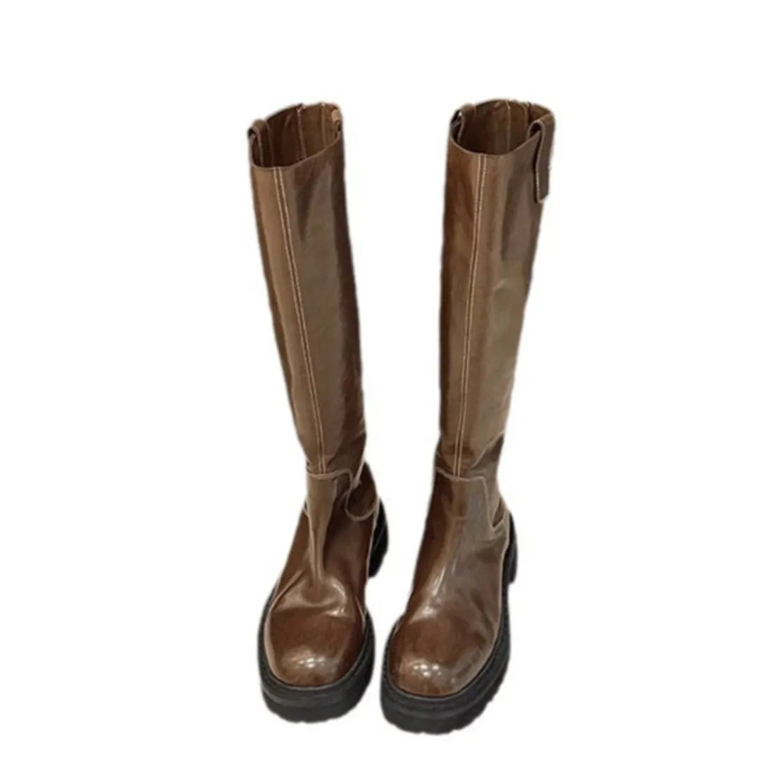 Women's black chunky heel knight boots with round toe and back zipper showing side profile