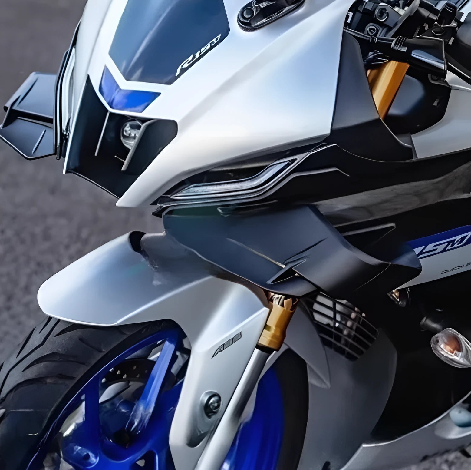Motorcycle bodywork side wing spoiler in matte black finish on a motorcycle rear fairing