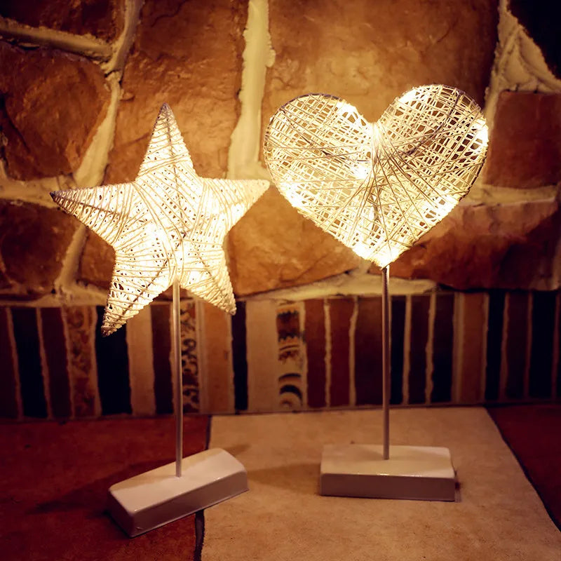 Rattan and copper wire LED table lamp in star, heart, or moon shape for bedroom decoration.
