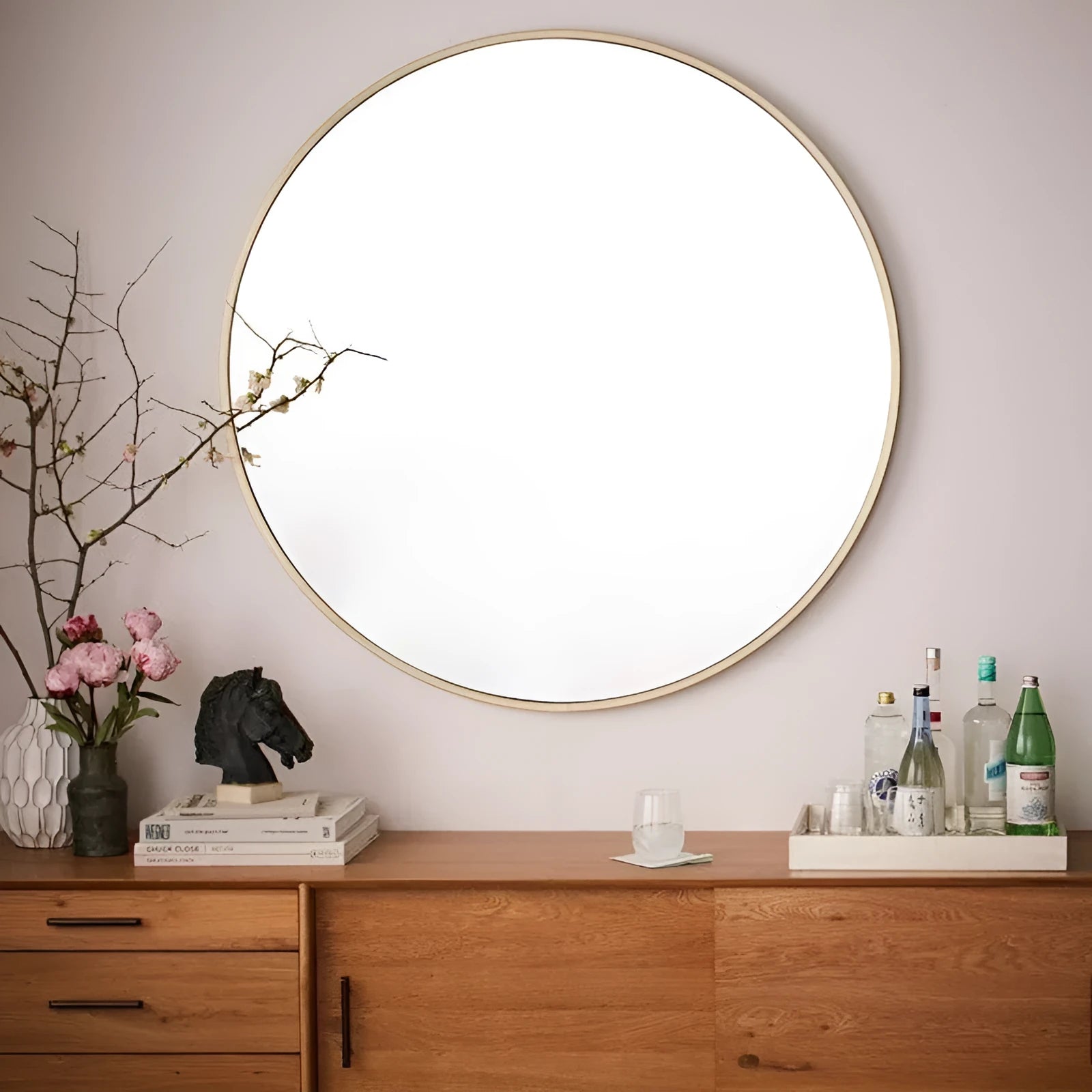 Round metal framed bathroom wall mirror in Nordic style available in black, white or gold