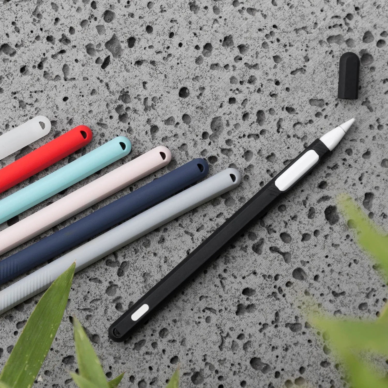 Silicone protective cover set for Apple Pencil 2 in peppermint green with storage case, showing non-slip grip design and magnetic charging compatibility