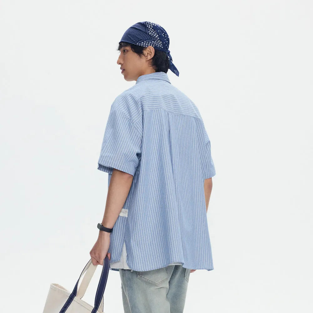 Blue striped overalls shirt for men and women in loose fit cardigan style with short sleeves