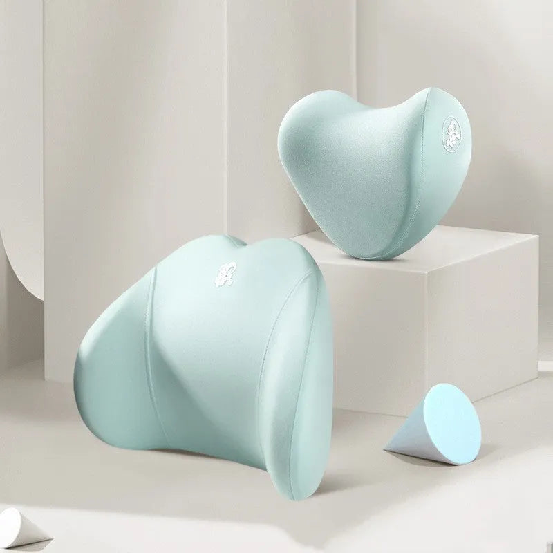 Heart-shaped car pillow in choice of colours, shown as headrest and lumbar support on a car seat.