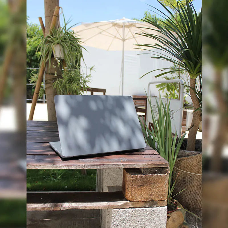 Quicksand Cobalt Gray polycarbonate protective shell for MacBook laptop on a desk