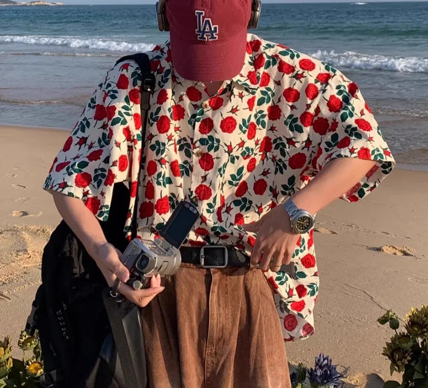 Summer Port retro rose-printed short-sleeved shirt in apricot colour on a model