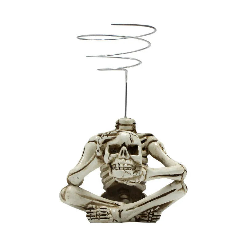 Gothic skull design resin Tillandsia bracket holding an air plant, showing its 12.5cm height.