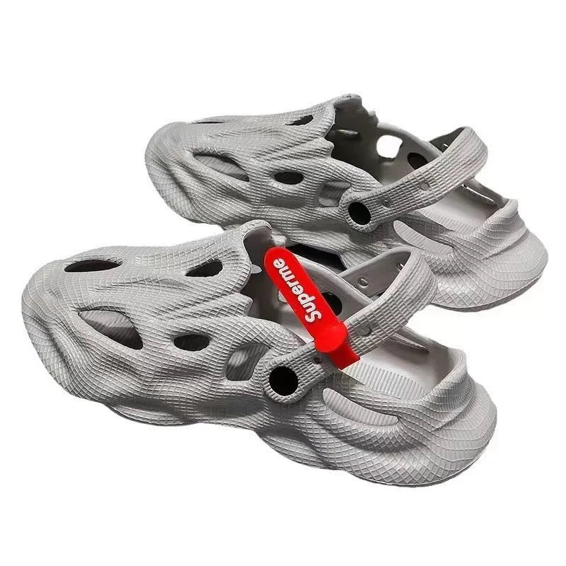 Coconut slippers in EVA foam with closed toe design and textured surface in grey colour