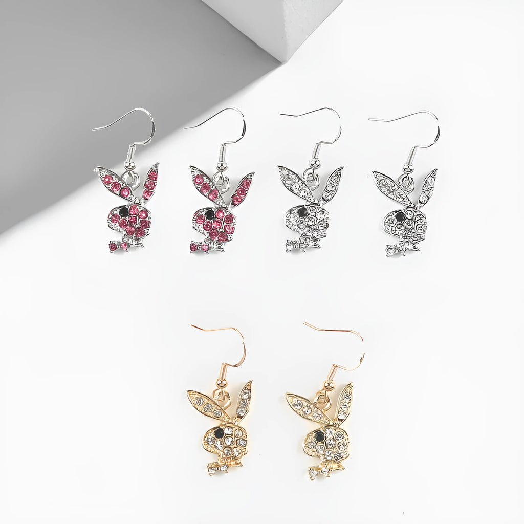 A pair of sparkling rabbit-shaped stud earrings with a full pavé cubic zirconia setting on a silver metal background.