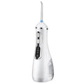 Portable oral irrigator in black, pink or white with rotating nozzle and USB charging